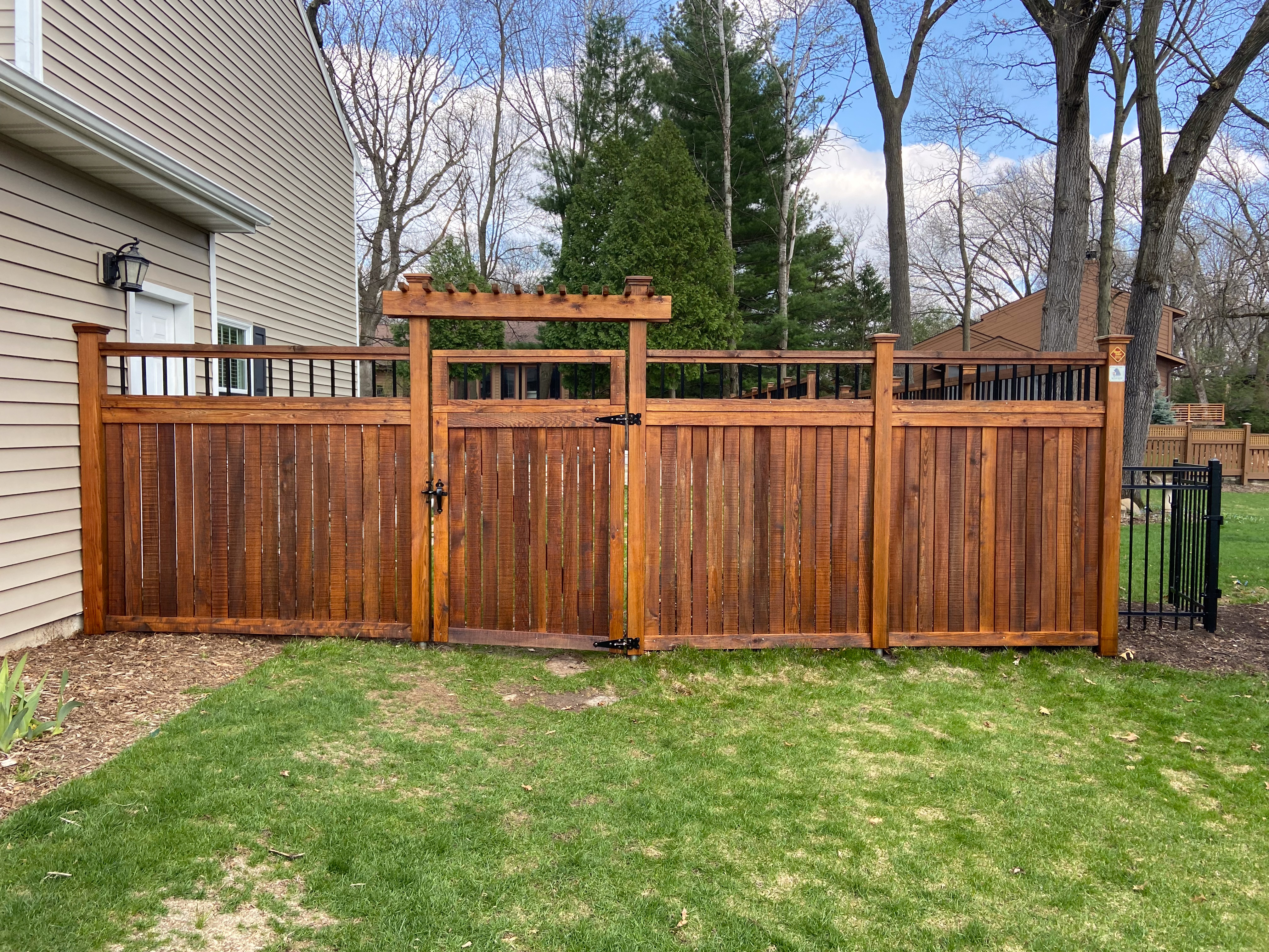Pecan stained fence after